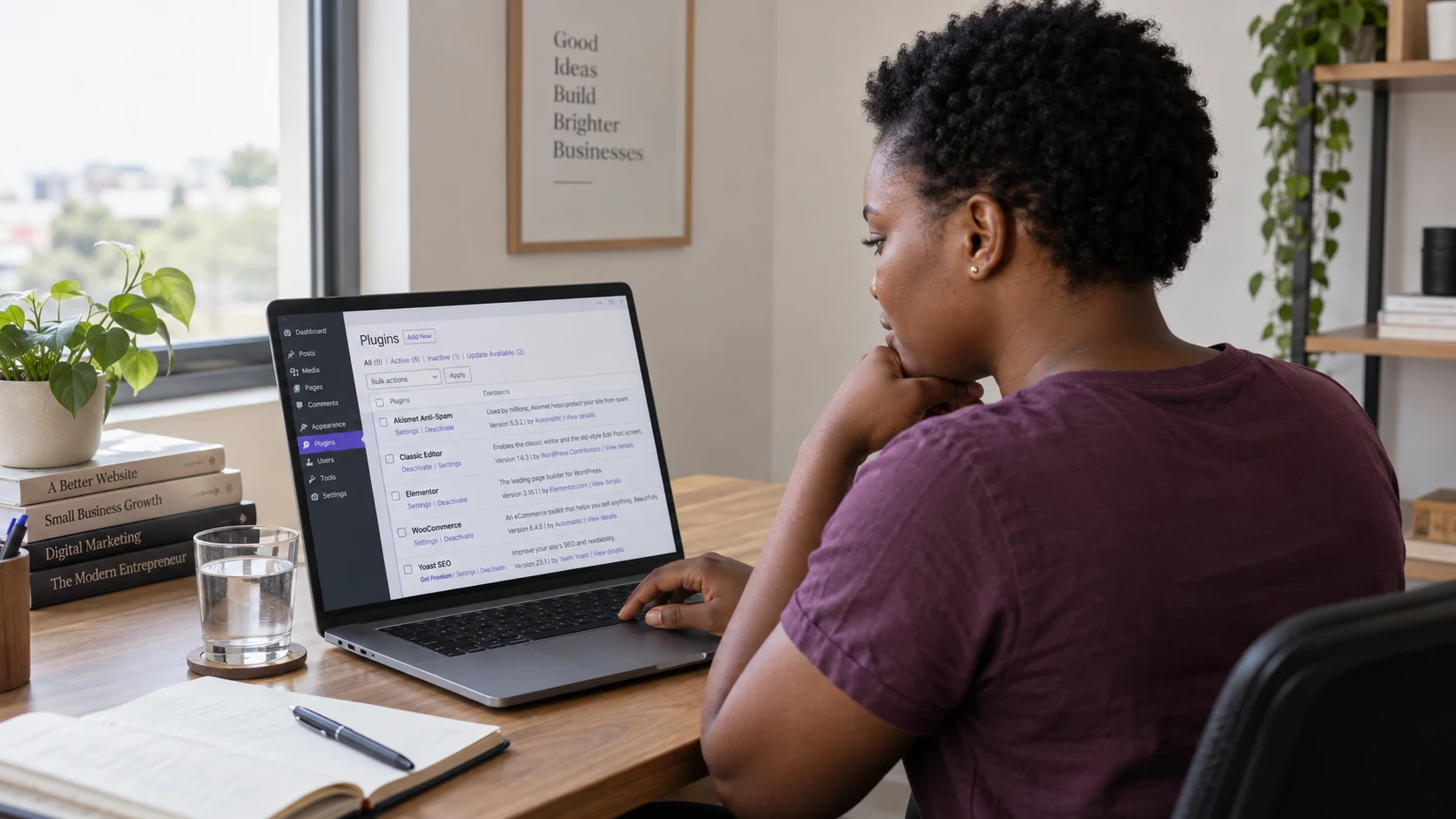 A business owner reviewing website plugins at her desk.